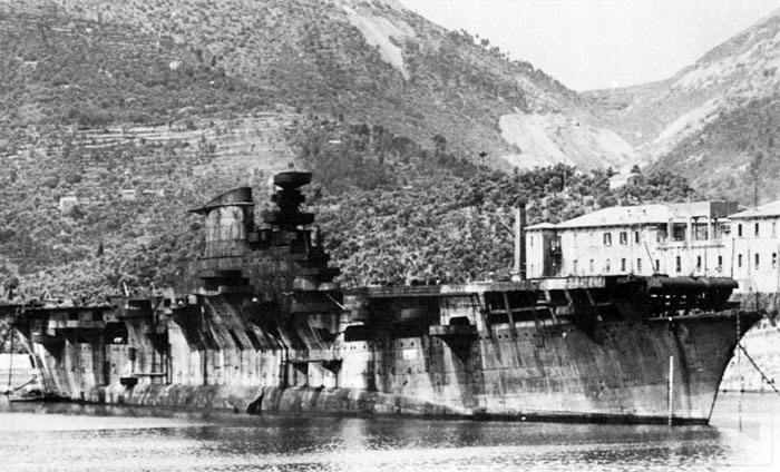 8614 - The rusted hulk of Aquila anchored at La Spezia in 1951, just before being scrapped